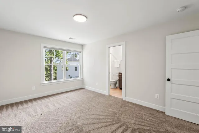 a view of a grassy field with trees