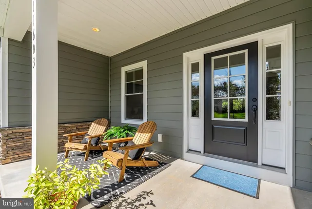 a kitchen with kitchen island a stove a table and chairs in it