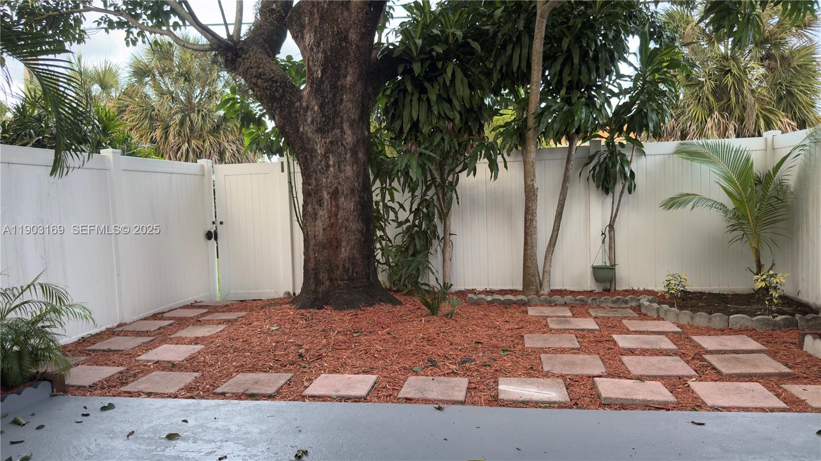 3908 Southwest 67th Terrace, Unit 112 Davie, FL 33314 - Photo 13 of 17 a view of a backyard of a house