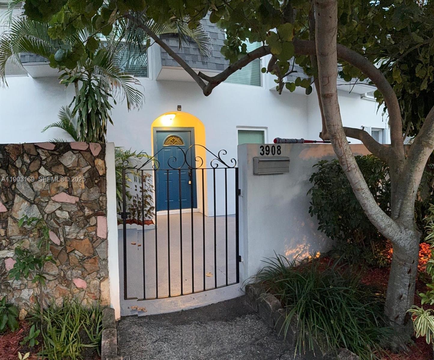 3908 Southwest 67th Terrace, Unit 112 Davie, FL 33314 - Photo 2 of 17 a view of entryway and garden
