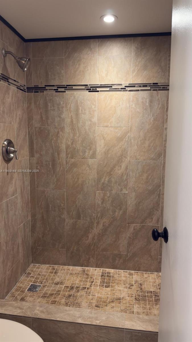 3908 Southwest 67th Terrace, Unit 112 Davie, FL 33314 - Photo 4 of 17 a bathroom with a shower