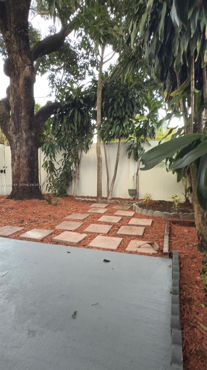 3908 Southwest 67th Terrace, Unit 112 Davie, FL 33314 - Photo 10 of 17 a view of a yard with an tree