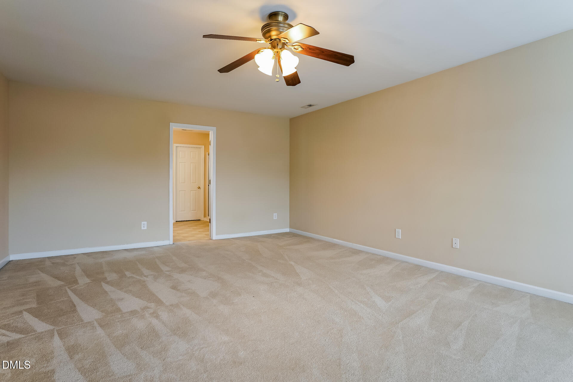 2279 Lazy River Drive Raleigh, NC 27610 - Photo 11 of 24 a view of a room with a ceiling fan and a window