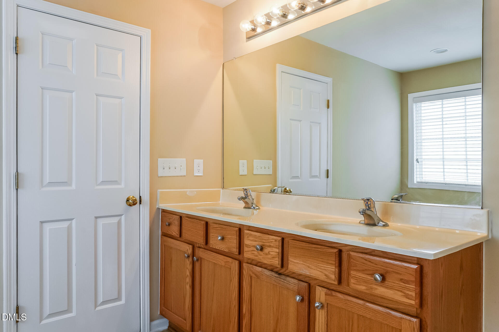 2279 Lazy River Drive Raleigh, NC 27610 - Photo 14 of 24 a bathroom with a sink and a mirror