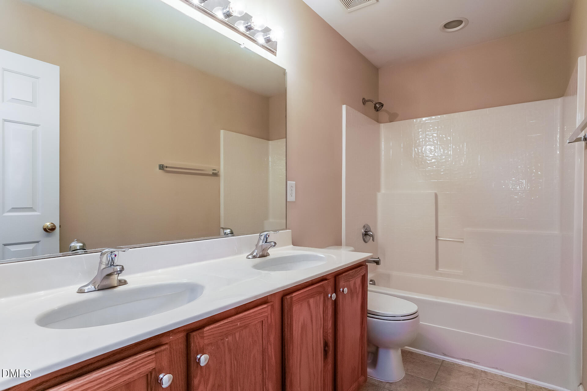 2279 Lazy River Drive Raleigh, NC 27610 - Photo 19 of 24 a bathroom with a sink a toilet and shower