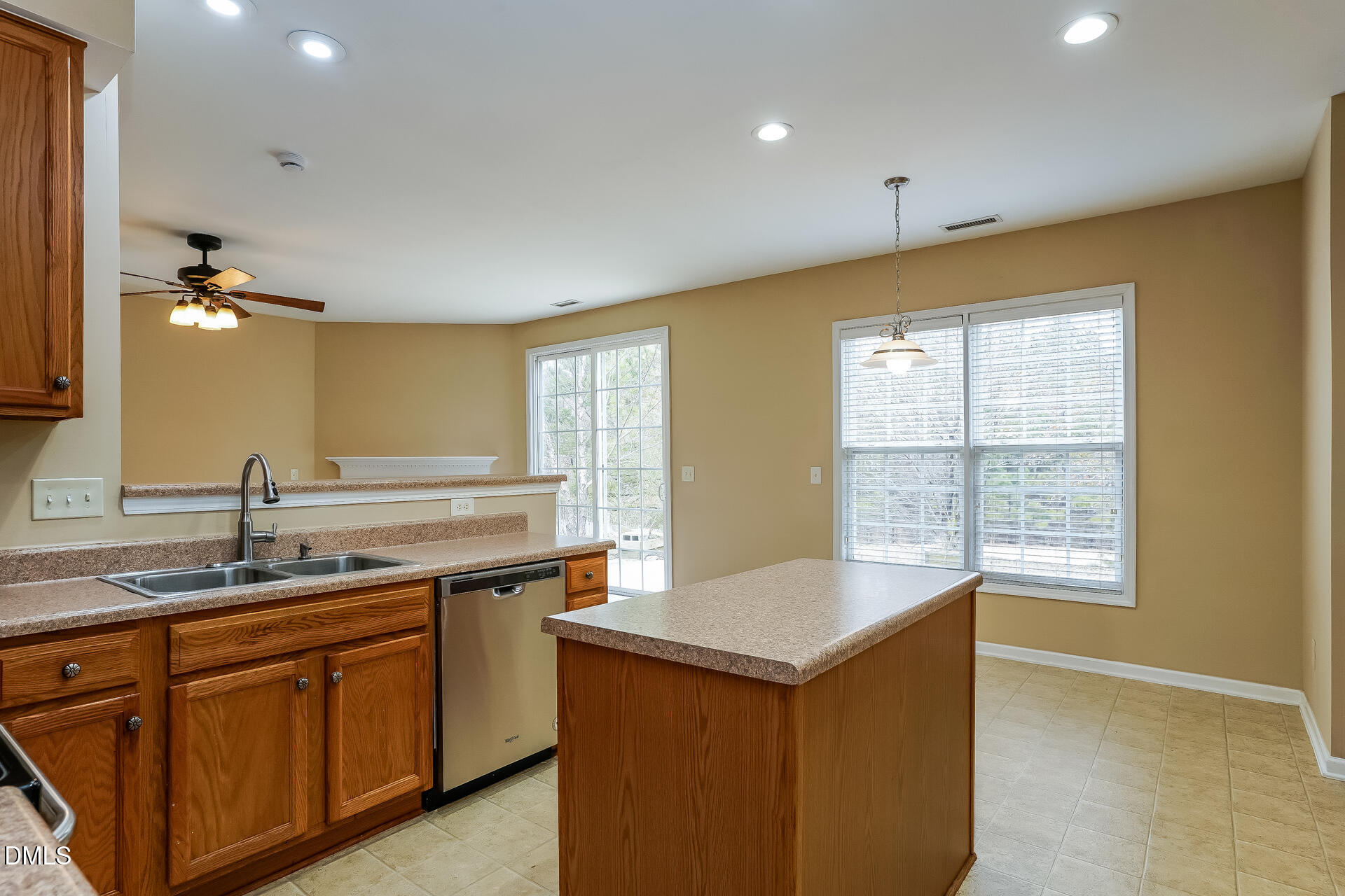 2279 Lazy River Drive Raleigh, NC 27610 - Photo 7 of 24 a kitchen with a sink stove and cabinets