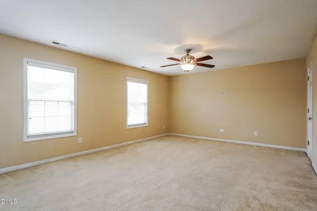 a kitchen with stainless steel appliances granite countertop a sink stove microwave and refrigerator