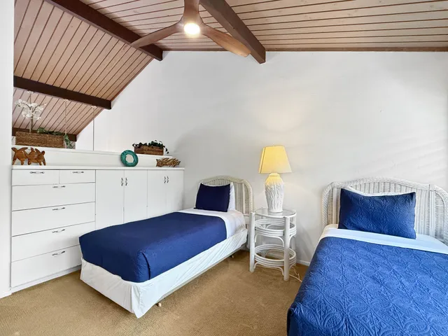 a bedroom with a bed and a dresser