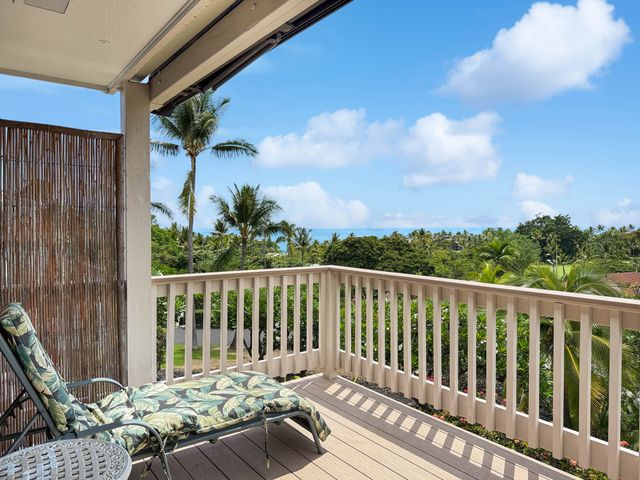 a balcony with wooden floor
