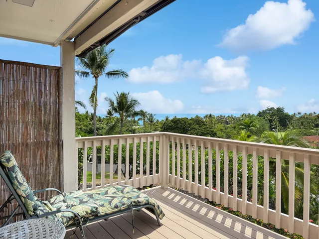 a balcony with wooden floor