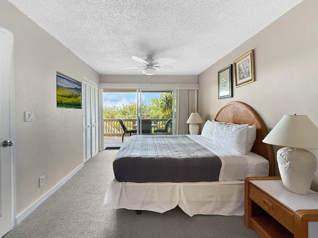 a bedroom with a bed and glass window
