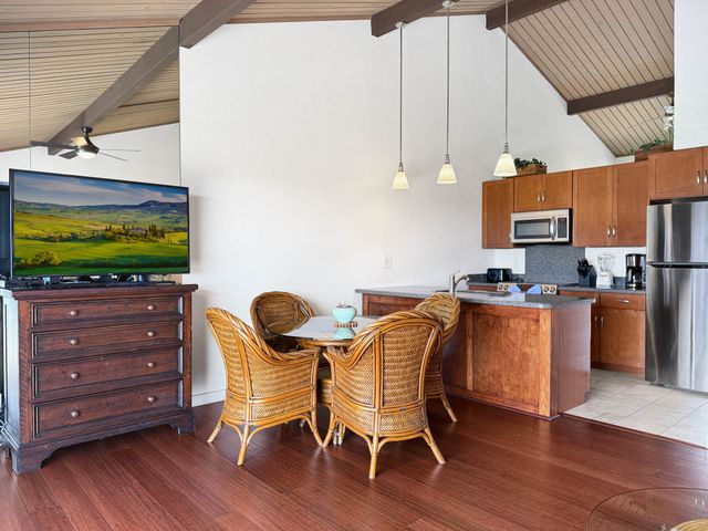 a dining room with furniture and wooden floor