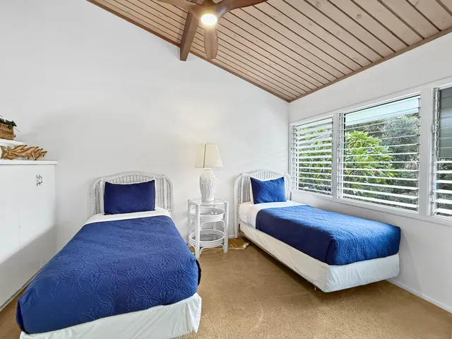 a spacious bedroom with a bed and window