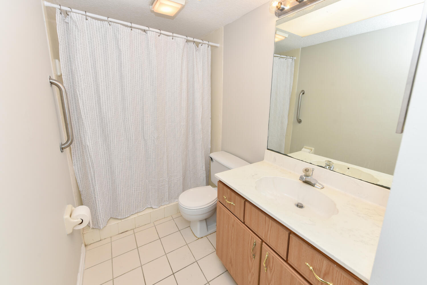 950 South Kanner Highway, Unit E4 Stuart, FL 34994 - Photo 25 of 28 a bathroom with a sink a toilet and shower