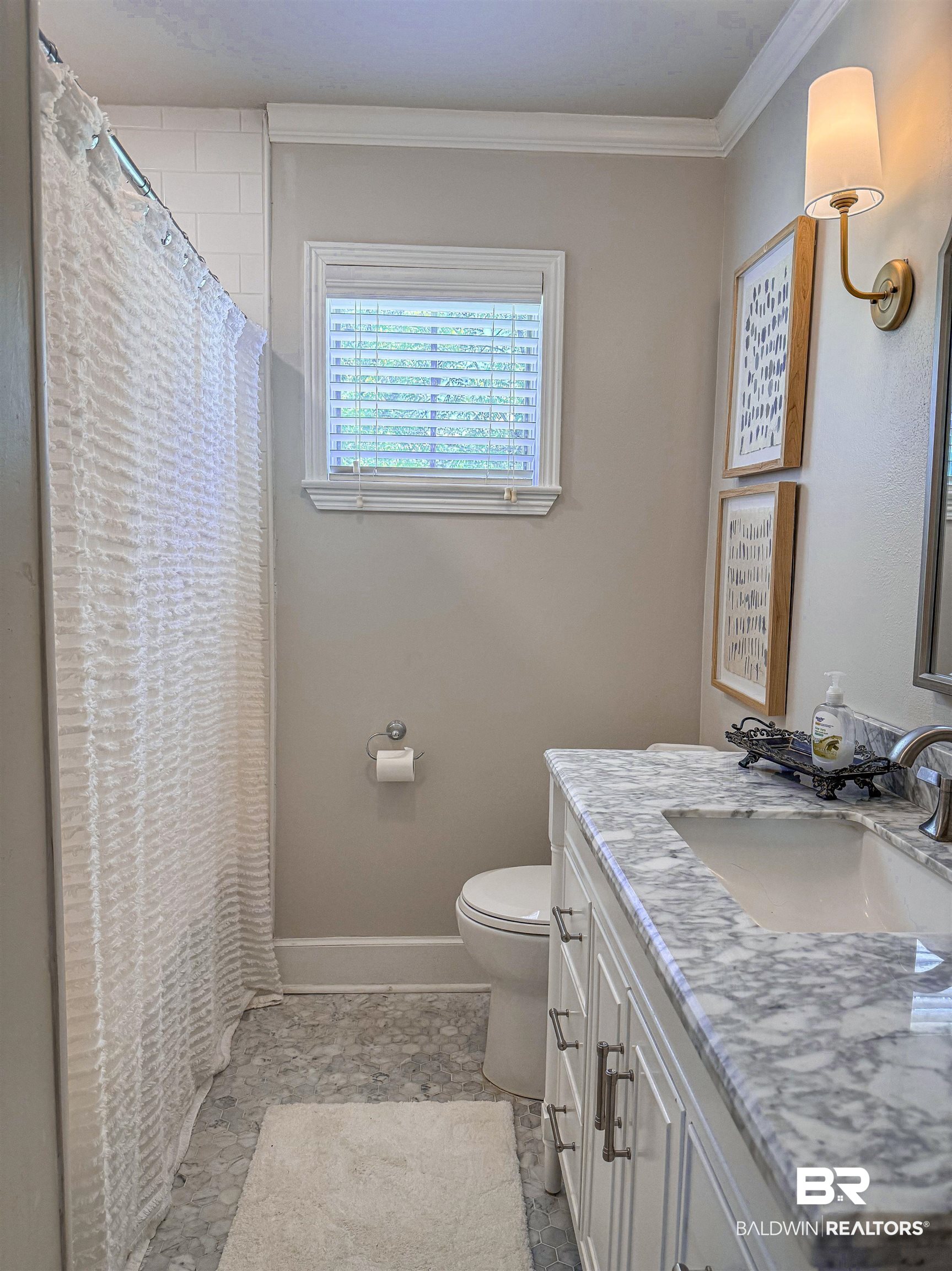 1508 Poplar Avenue Brewton, AL 36426 - Photo 17 of 22 Full bath with vanity, ornamental molding, and a shower with shower curtain