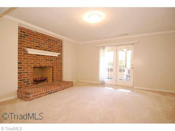 117 Windrush Road Winston-Salem, NC 27106 - Photo 8 of 9 Other. Day light lower level playroom opens to patio and backyard.