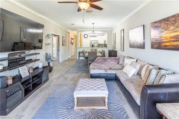 a living room with furniture and a rug