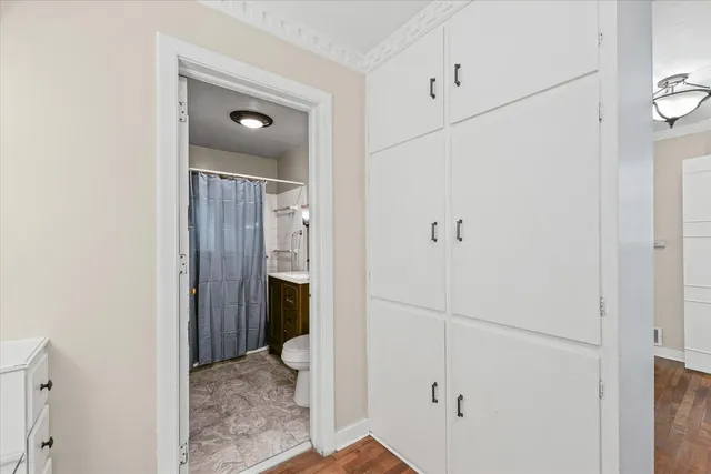 a view of a bathroom with wooden floor