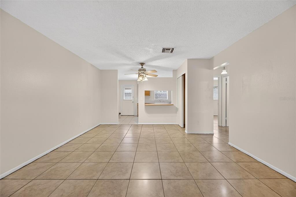 3753 141st Place North Largo, FL 33771 - Photo 13 of 44 a view of a kitchen with a sink and a chandelier fan