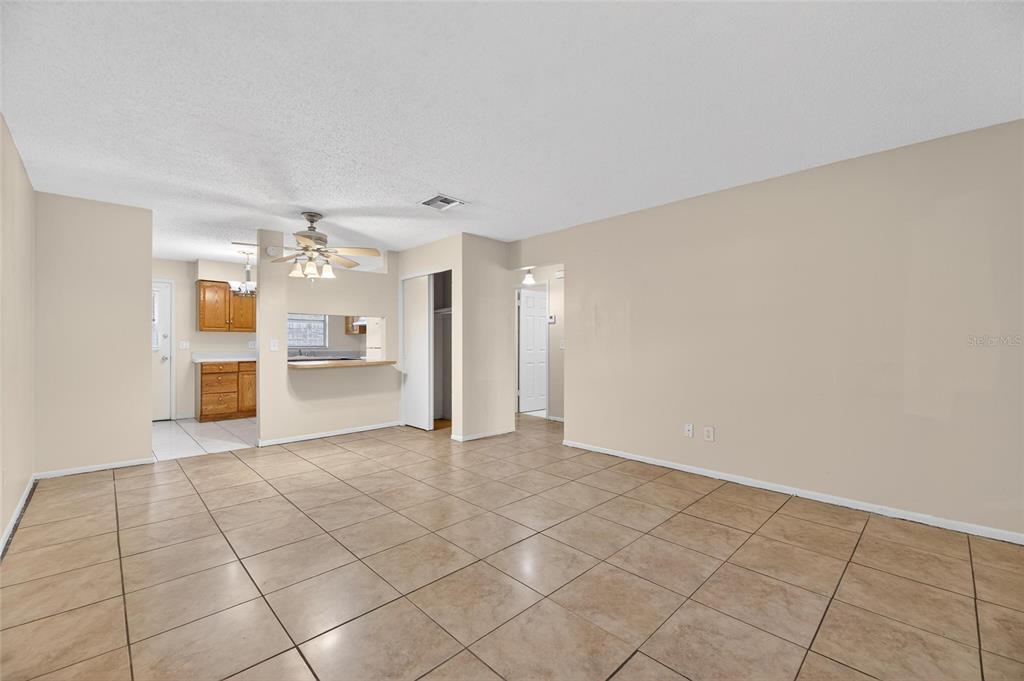 3753 141st Place North Largo, FL 33771 - Photo 14 of 44 a view of a kitchen with a sink and a refrigerator a cabinets