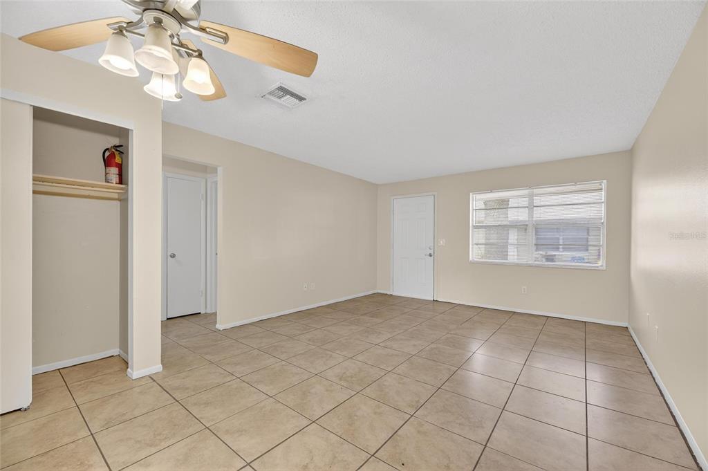 3753 141st Place North Largo, FL 33771 - Photo 15 of 44 an empty room with windows and fan