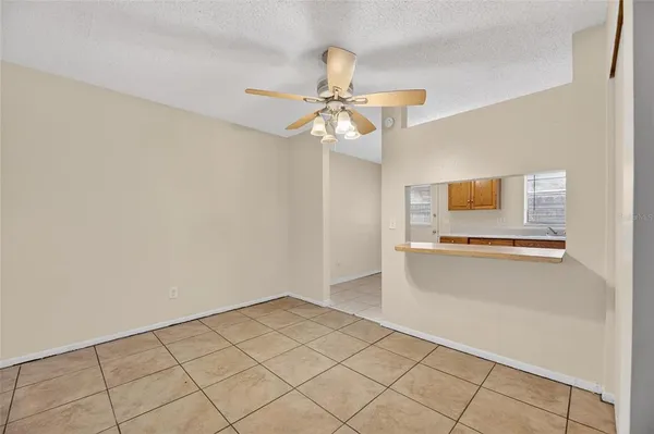 a kitchen with stainless steel appliances granite countertop a refrigerator sink and stove