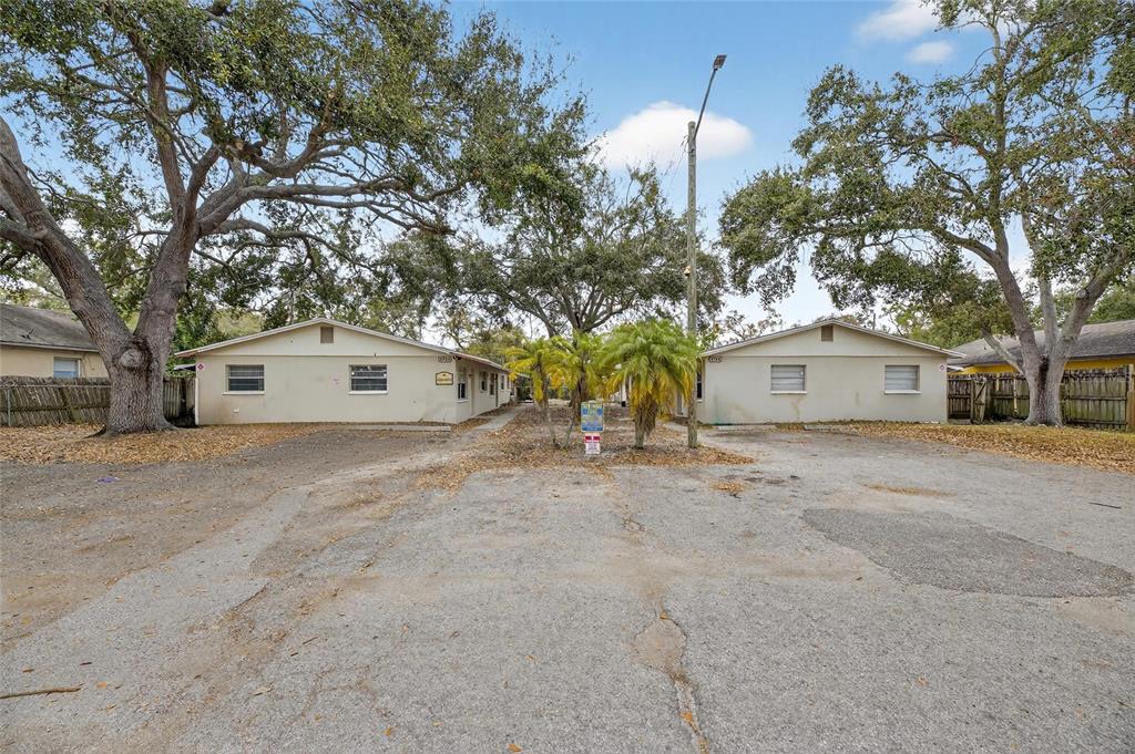 3753 141st Place North Largo, FL 33771 - Photo 2 of 44 a view of a house with a yard and garage