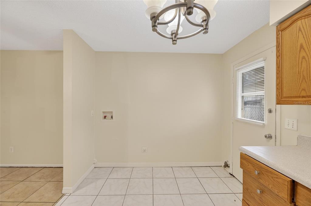 3753 141st Place North Largo, FL 33771 - Photo 26 of 44 a bathroom with a sink a vanity and window
