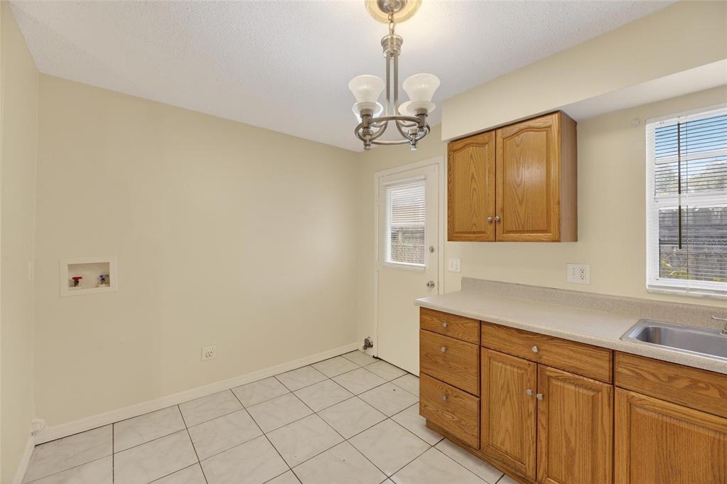 3753 141st Place North Largo, FL 33771 - Photo 27 of 44 a kitchen with a sink cabinets and window