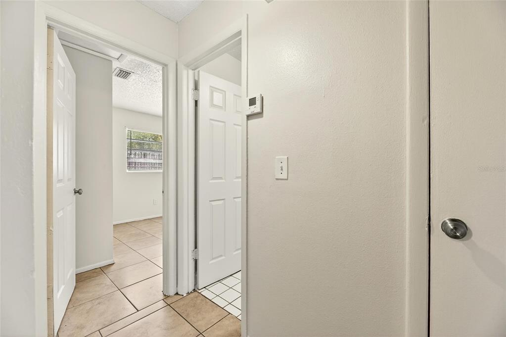 3753 141st Place North Largo, FL 33771 - Photo 28 of 44 a bathroom with a glass shower door