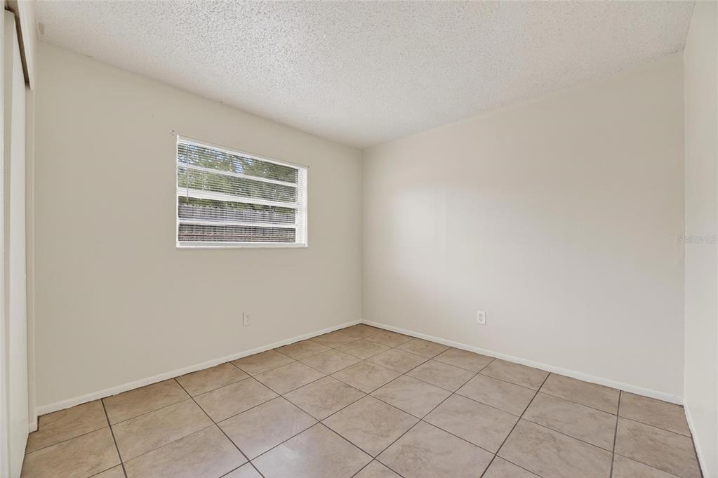 3753 141st Place North Largo, FL 33771 - Photo 29 of 44 an empty room with windows