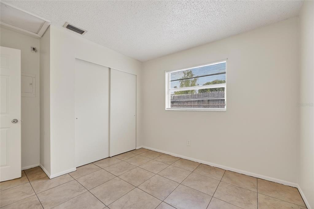 3753 141st Place North Largo, FL 33771 - Photo 30 of 44 a view of an empty room with a window