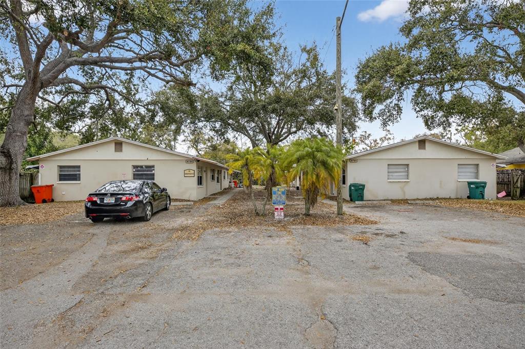 3753 141st Place North Largo, FL 33771 - Photo 3 of 44 a view of a house with a large tree