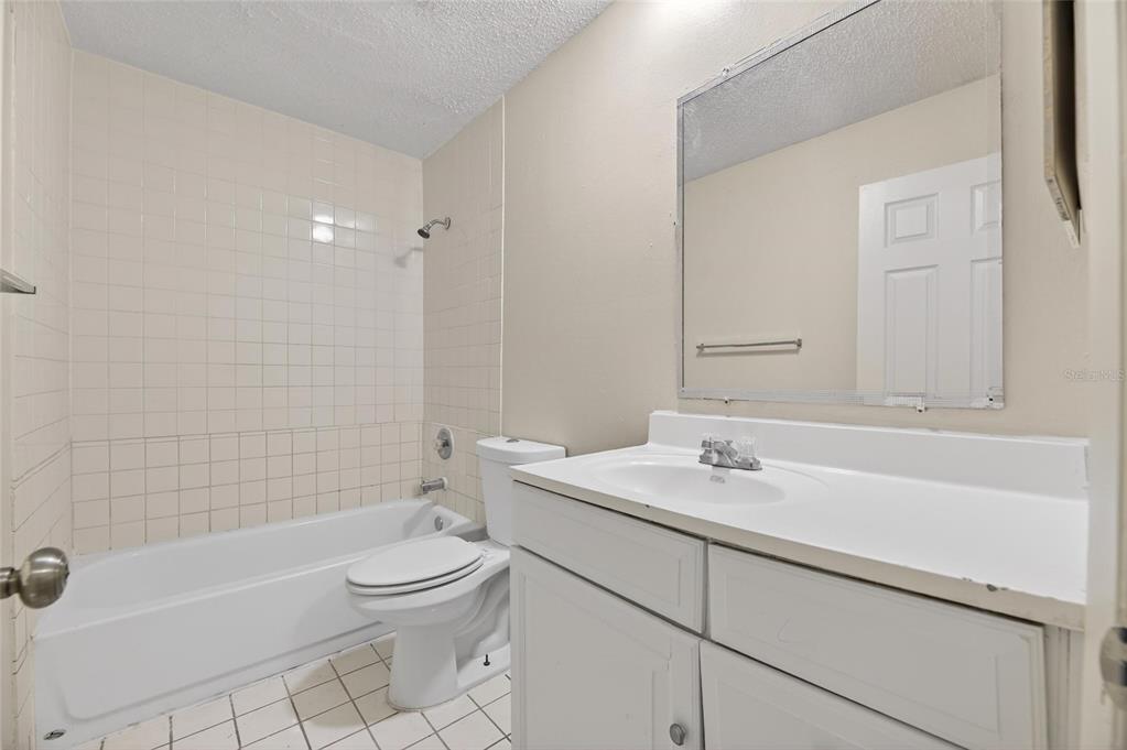 3753 141st Place North Largo, FL 33771 - Photo 32 of 44 a bathroom with a sink a toilet and shower