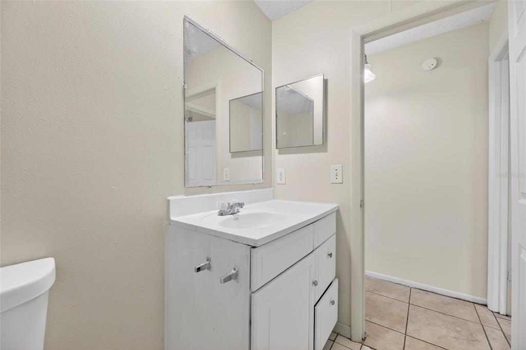 3753 141st Place North Largo, FL 33771 - Photo 34 of 44 a bathroom with a sink vanity and a mirror