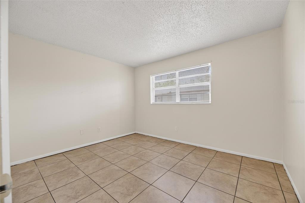 3753 141st Place North Largo, FL 33771 - Photo 35 of 44 an empty room with windows