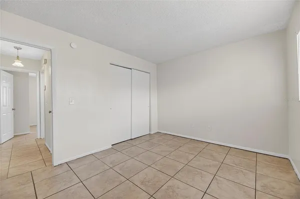 a kitchen with a sink cabinets and window