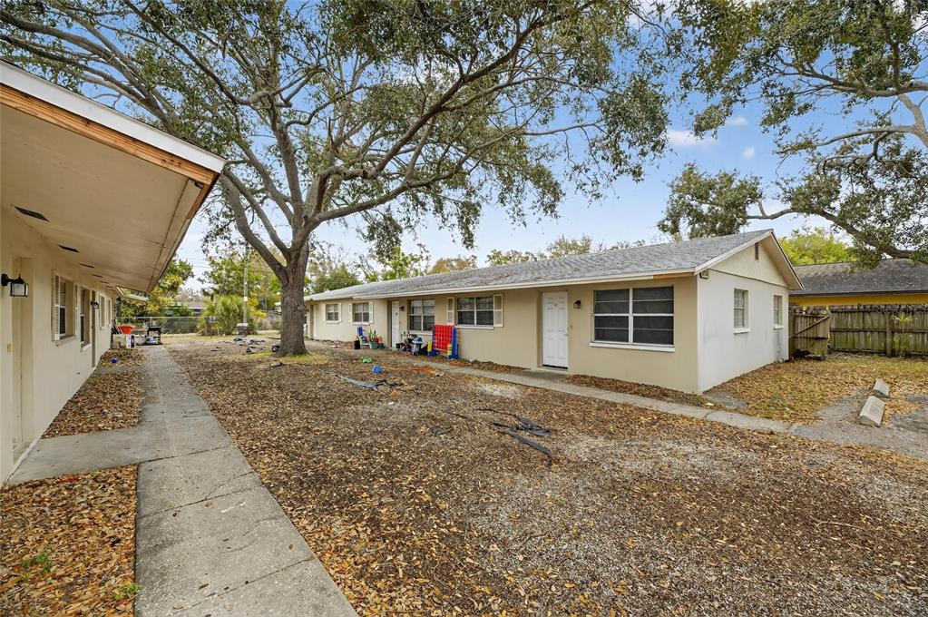3753 141st Place North Largo, FL 33771 - Photo 7 of 44 a view of a house with a yard