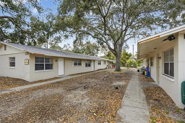a dirt road with an outdoor space