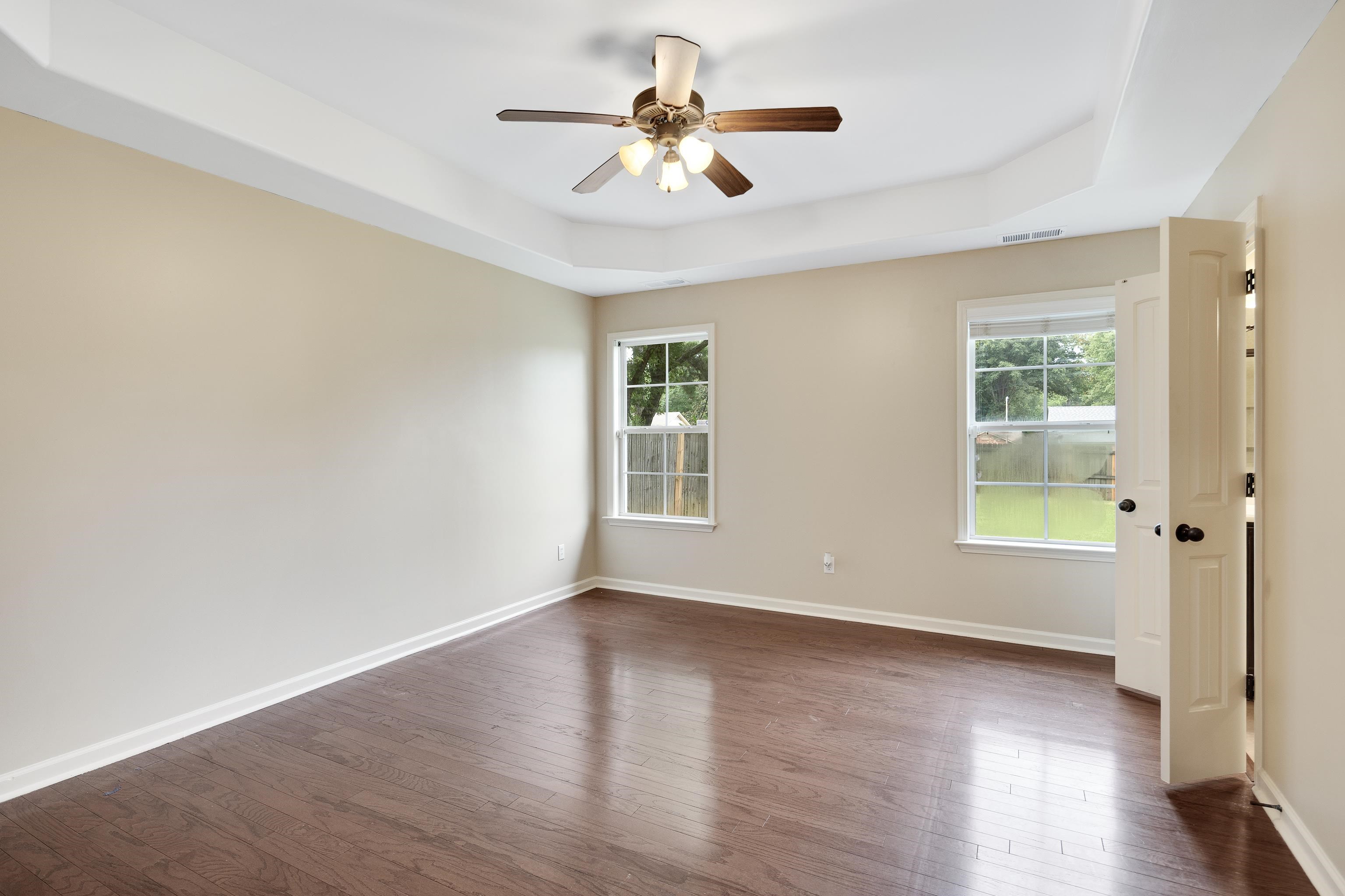 379 Shelton Road Collierville, TN 38017 - Photo 15 of 32 a view of empty room with wooden floor and fan