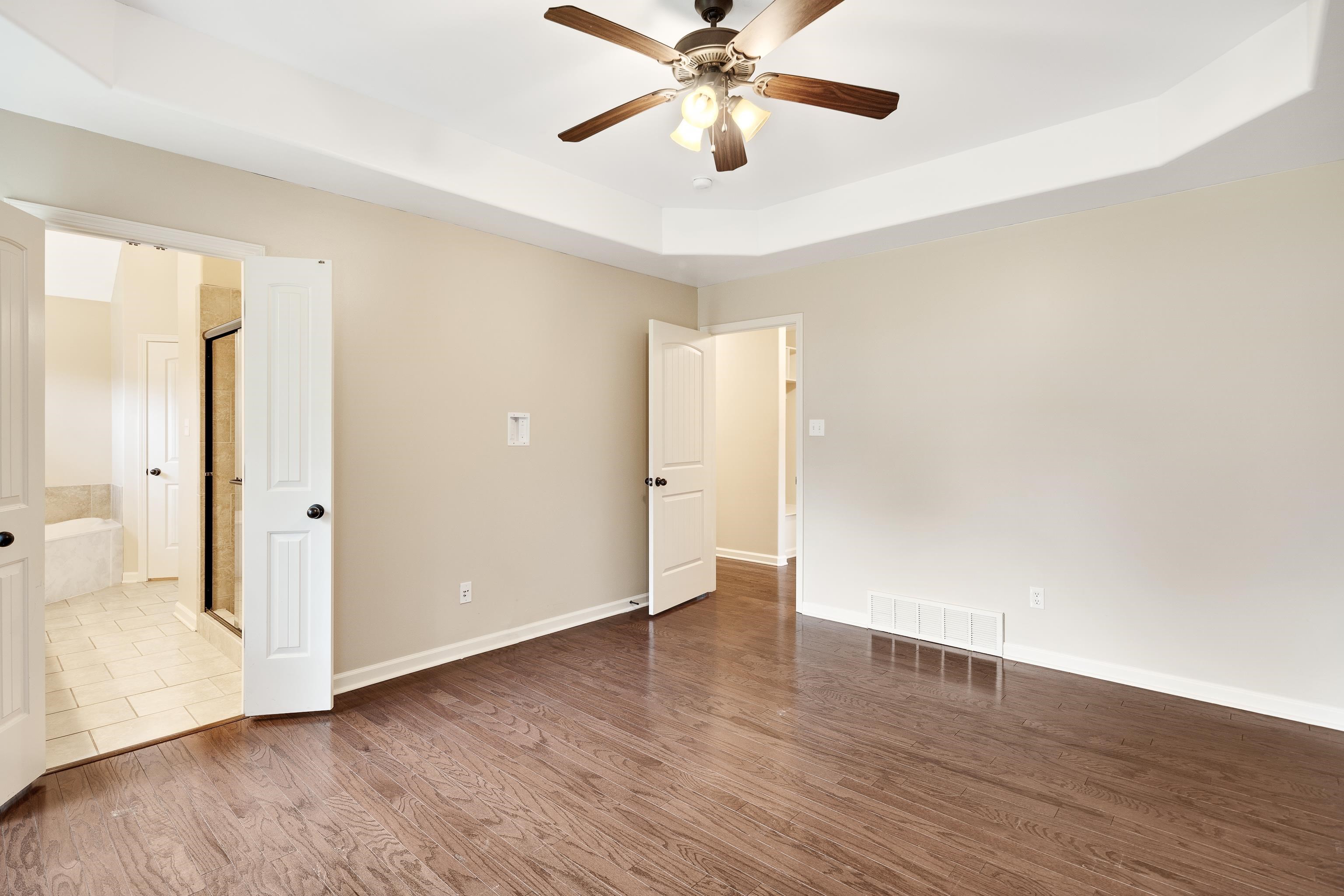 379 Shelton Road Collierville, TN 38017 - Photo 16 of 32 a view of an empty room with wooden floor