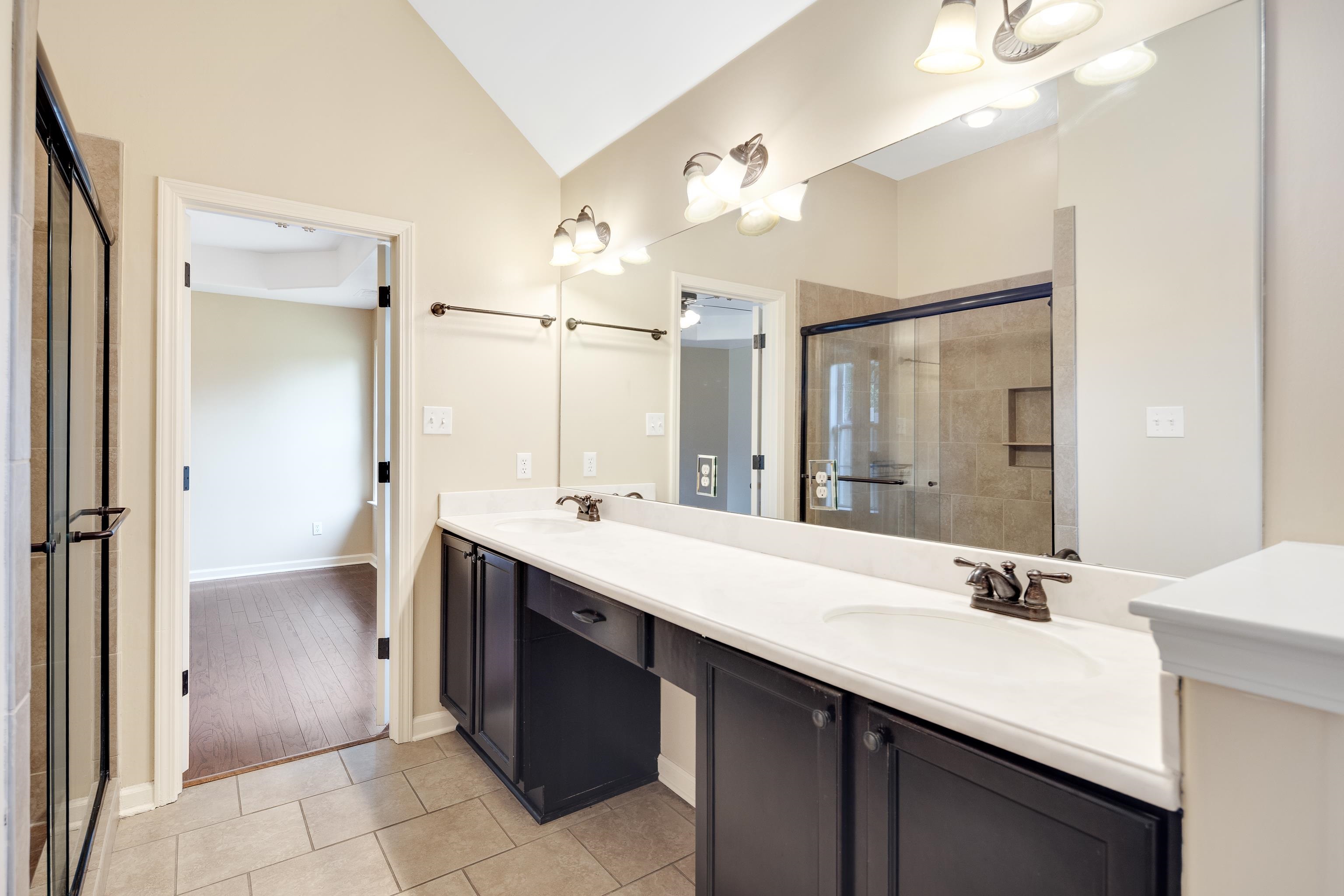 379 Shelton Road Collierville, TN 38017 - Photo 19 of 32 a bathroom with a double vanity sink mirror and double
