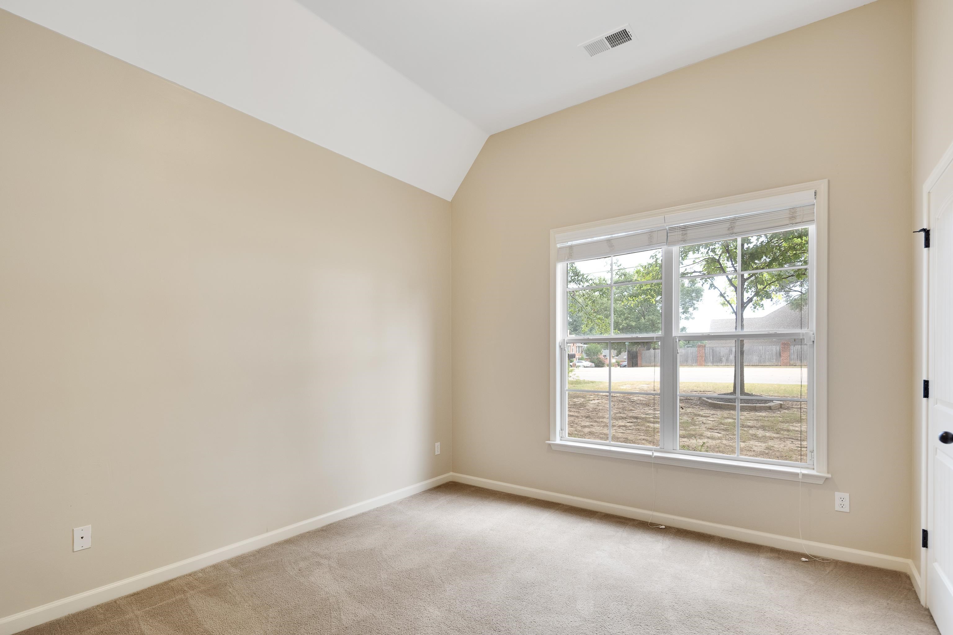 379 Shelton Road Collierville, TN 38017 - Photo 21 of 32 a view of an empty room with a window