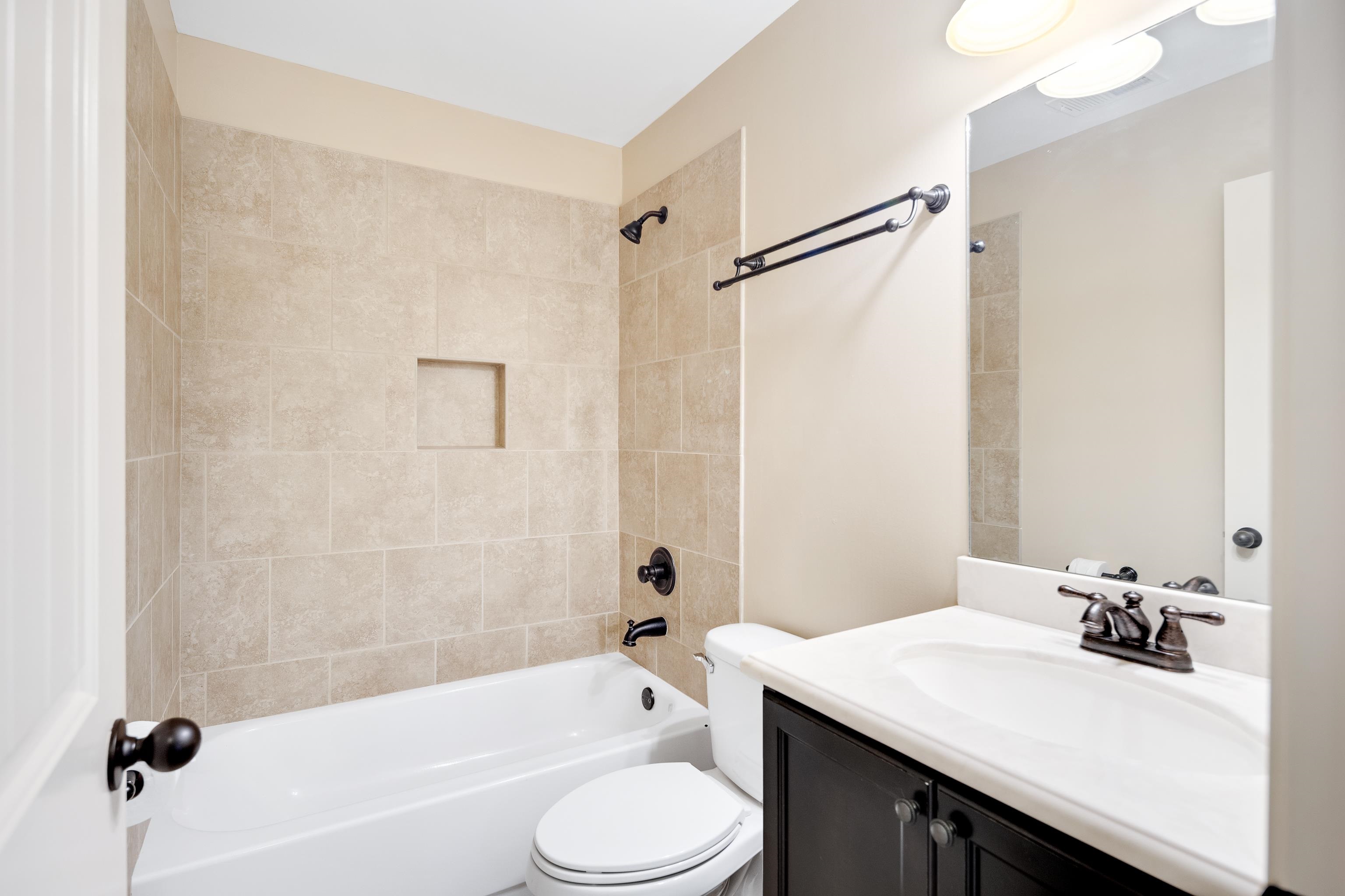 379 Shelton Road Collierville, TN 38017 - Photo 23 of 32 a bathroom with a sink a toilet and a bathtub