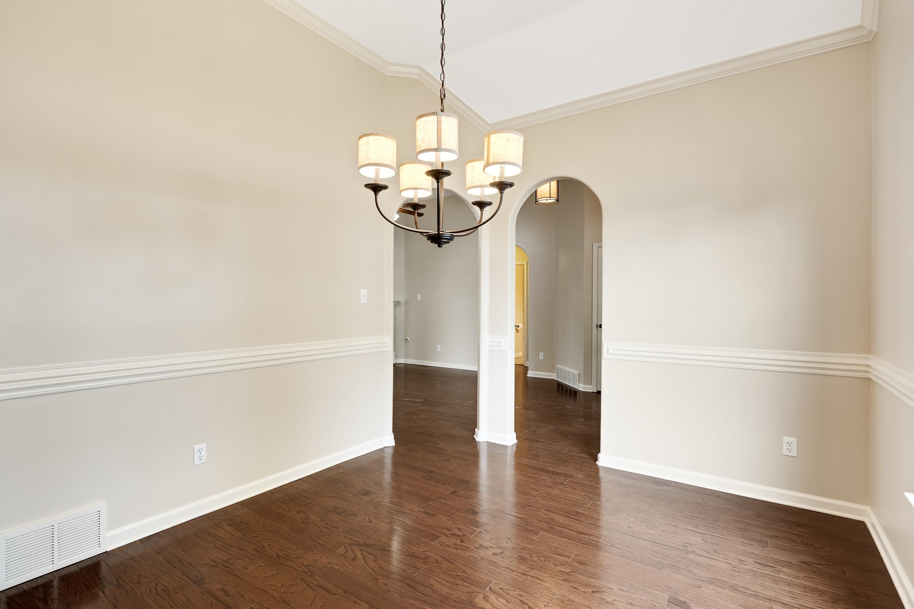 379 Shelton Road Collierville, TN 38017 - Photo 6 of 32 a view of a room with wooden floor and a chandelier