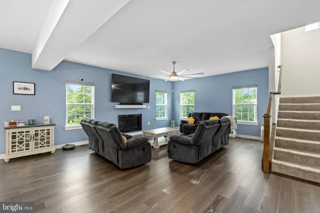 a bathroom with a sink mirror vanity and toilet