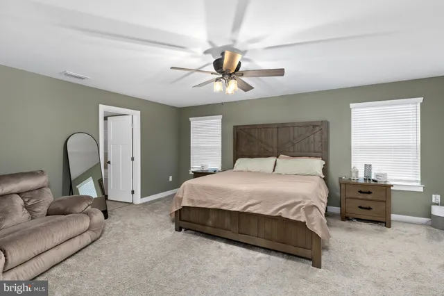 a bedroom with furniture and a window