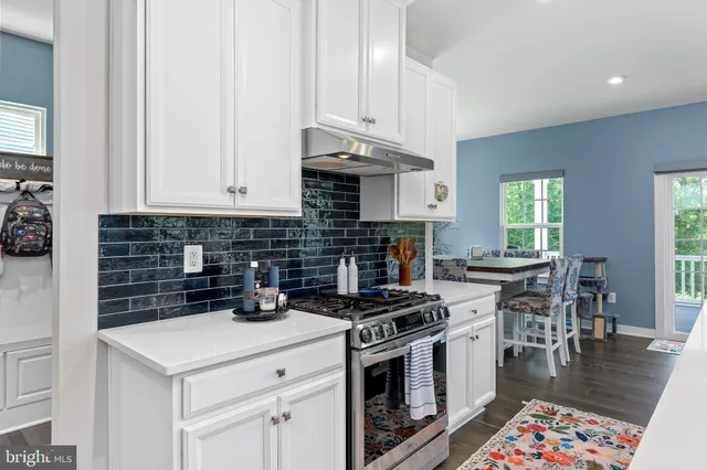a kitchen with a sink stove and refrigerator