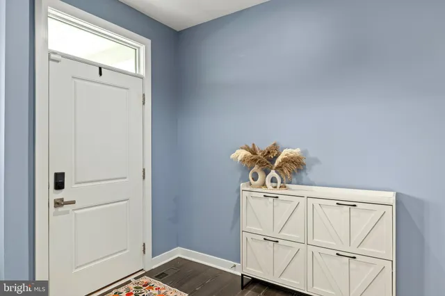 a view of a patio with a table and chairs