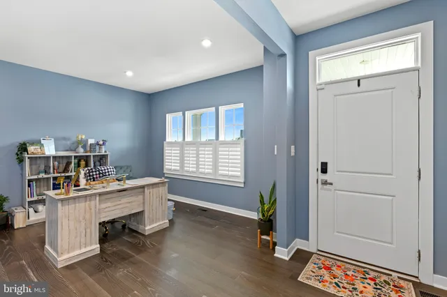 an aerial view of a house with swimming pool garden and mountain view